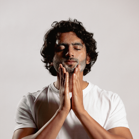 Man with cleanser applied onto the face.