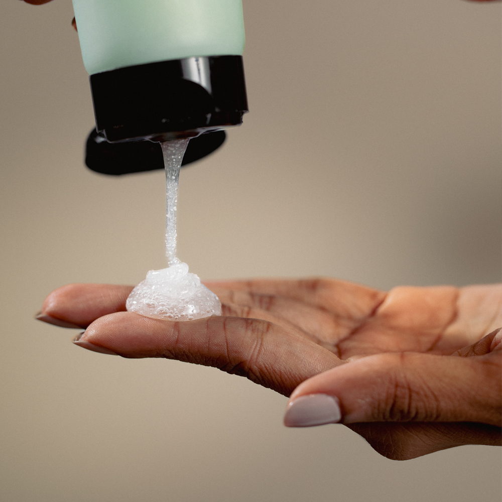 Facial Cleanser texture shown on hand.