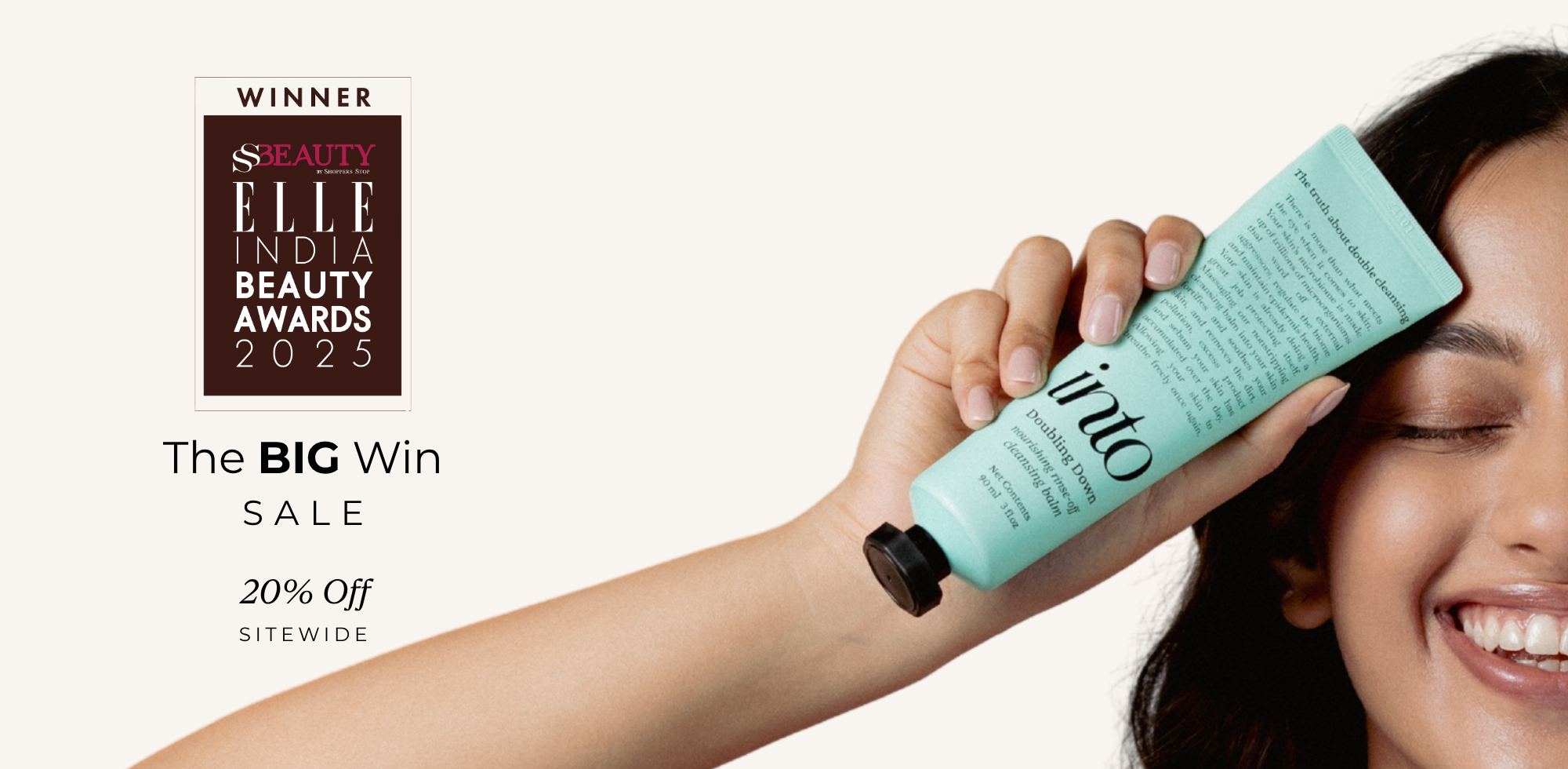 Person applying a green skincare product to their face with an award badge in the corner.